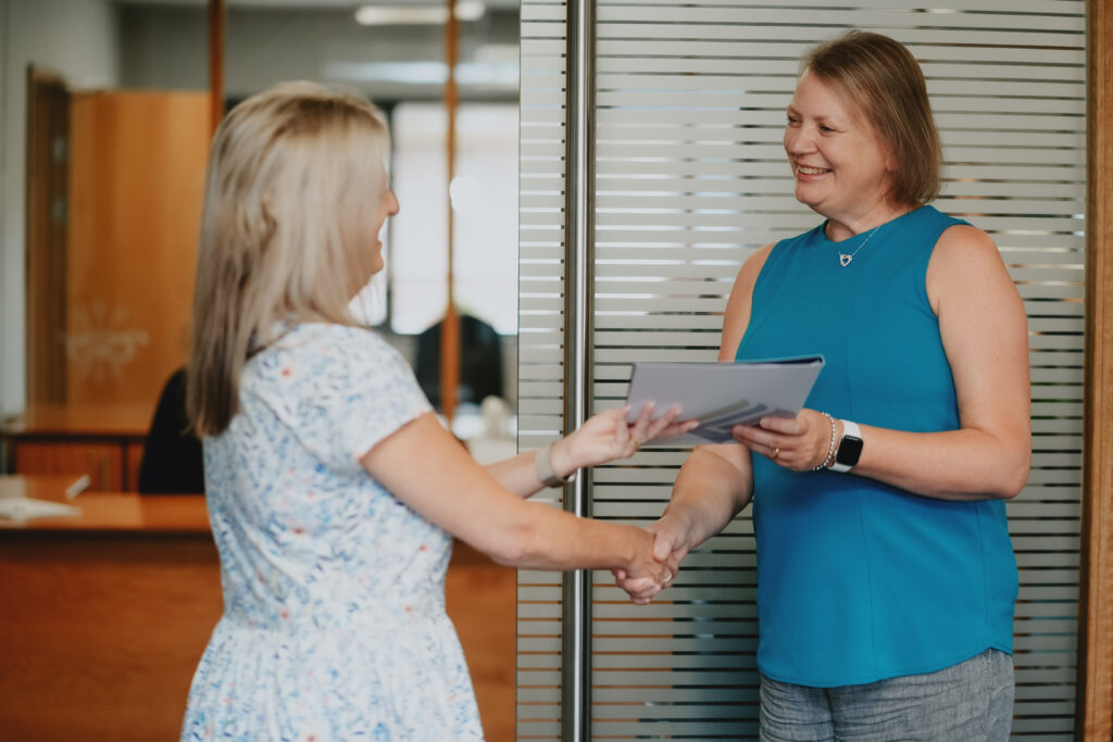 Fogwill & Jones advisor and client shaking hands after meeting