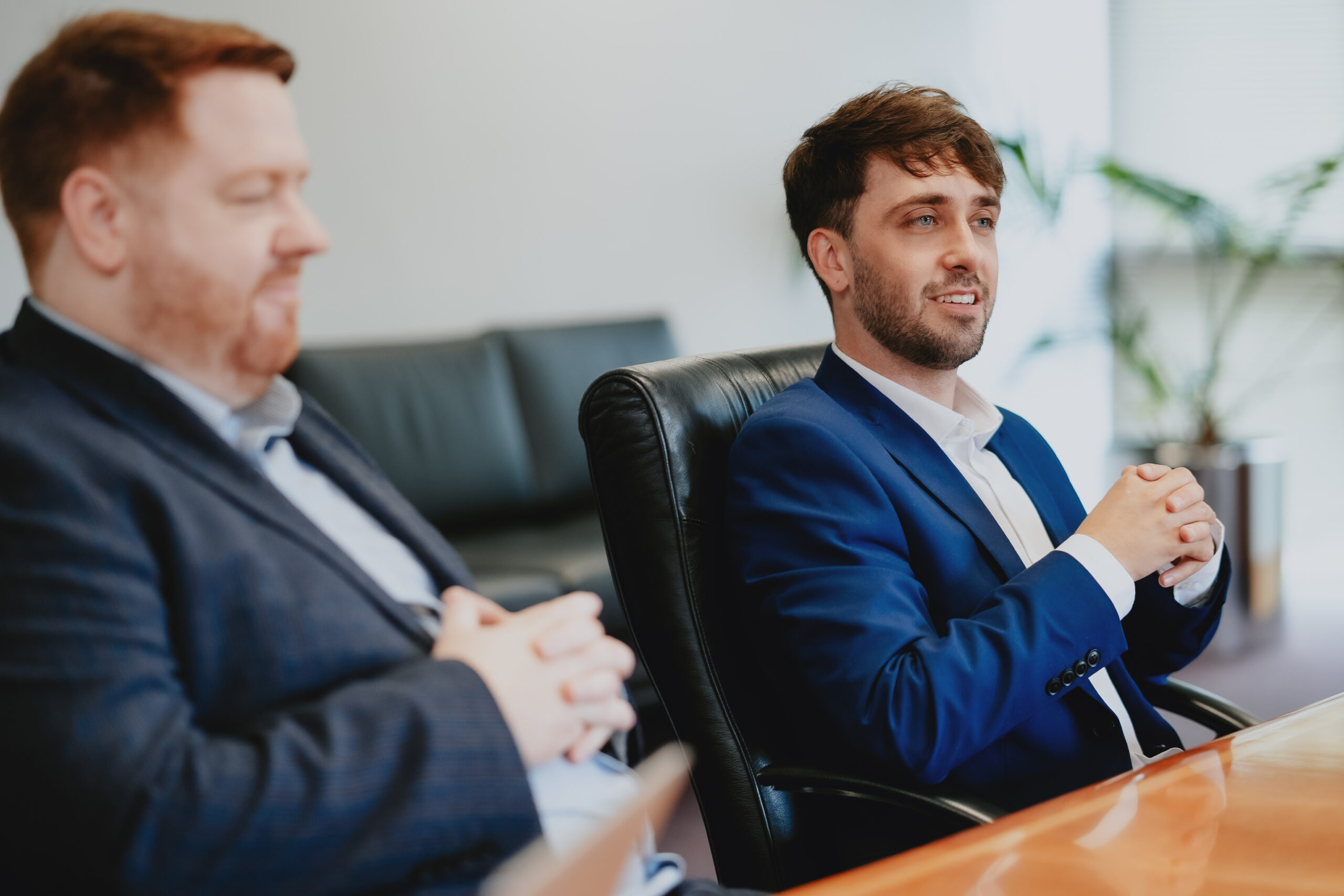 Robert and Liam sat at meeting table