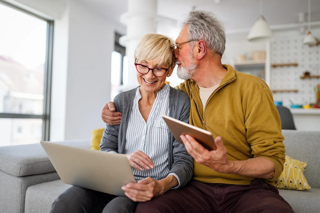 Happy Senior Couple Hugging and Enjoying Retirement at Home